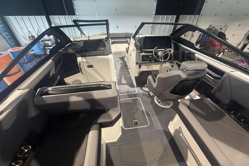 Slide: The Image of 2024 Cobalt R8 Surf boat interior with modern seating and sleek dashboard design. - 11