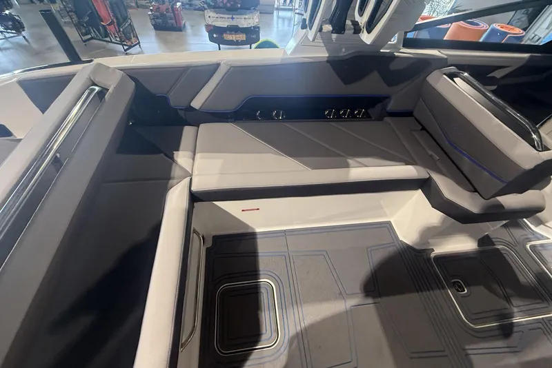 Slide: The Image of 2024 Cobalt R8 Surf boat interior with sleek seating and modern design. - 13