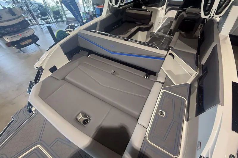 Slide: The Image of 2024 Cobalt R8 Surf boat interior with sleek seating and modern design. - 15