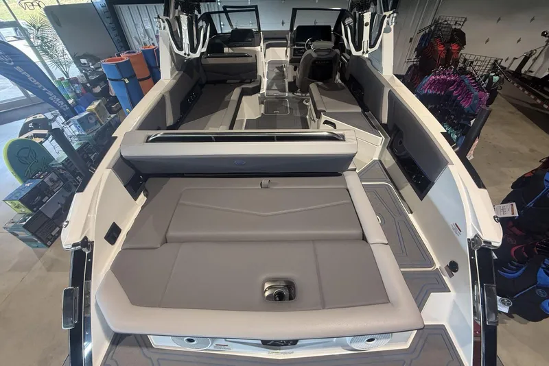 Slide: The Image of 2024 Cobalt R8 Surf boat interior with spacious seating and modern design in showroom. - 16