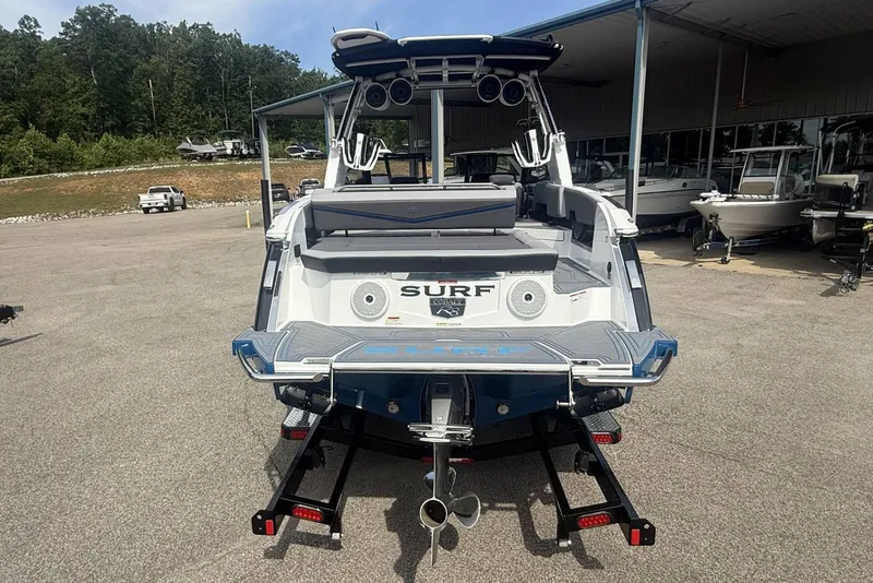 Slide: The Image of 2024 Cobalt R8 Surf boat rear view at a dealership, showcasing sleek design and features. - 5