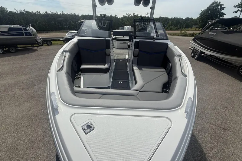 Slide: The Image of 2024 Cobalt R8 Surf boat interior with sleek seating and modern design. - 9