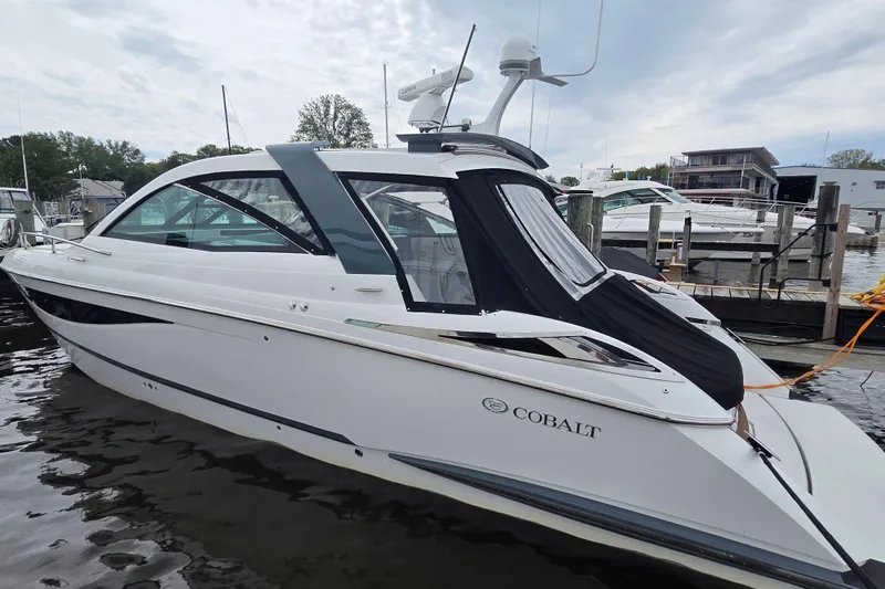 The Image of 2017 Cobalt A40 Coupe docked at marina, sleek design, overcast sky. - 0