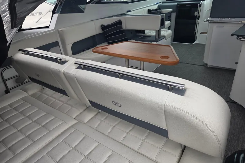 Slide: The Image of Interior of 2017 Cobalt A40 Coupe with white seating and wooden table. - 16
