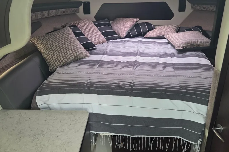Slide: The Image of Cozy interior of 2017 Cobalt A40 Coupe with striped bedding and decorative pillows. - 27