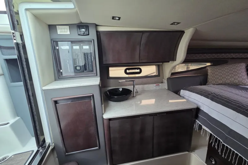Slide: The Image of Interior of 2017 Cobalt A40 Coupe featuring a compact kitchenette and cozy sleeping area. - 29