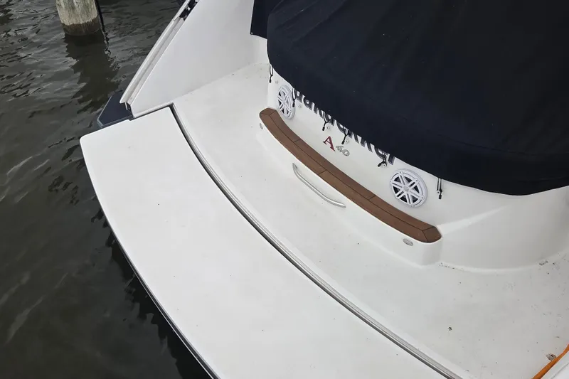 Slide: The Image of 2017 Cobalt A40 Coupe boat stern with covered deck and speakers. - 3
