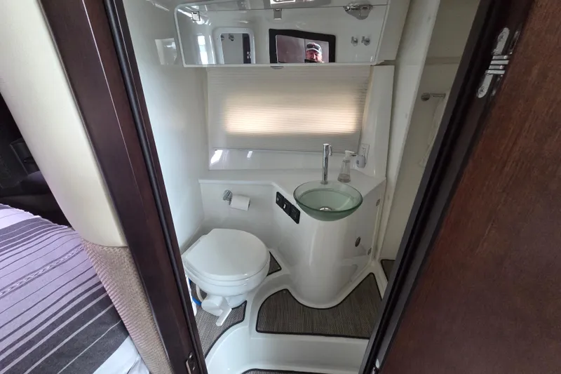 Slide: The Image of Compact bathroom in 2017 Cobalt A40 Coupe with modern fixtures and glass sink. - 32