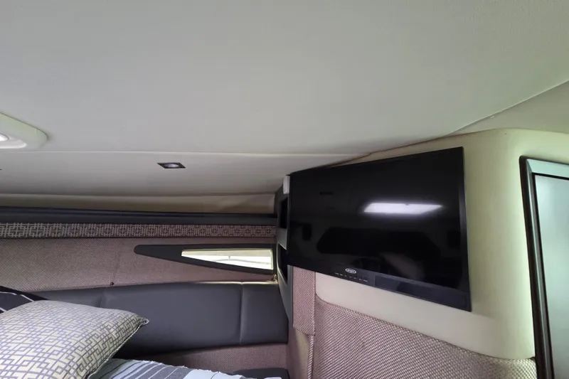 Slide: The Image of Interior of 2017 Cobalt A40 Coupe with mounted TV and cozy bedding. - 34
