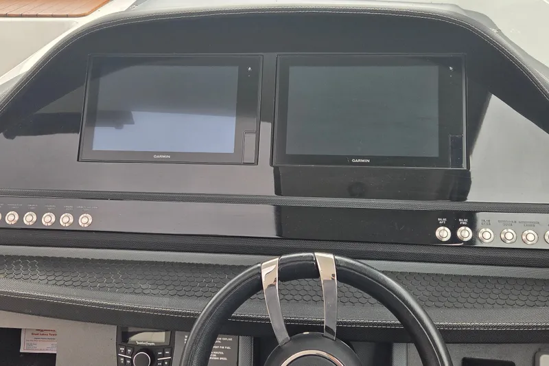 Slide: The Image of Dashboard of a 2017 Cobalt A40 Coupe with Garmin displays and control buttons. - 6