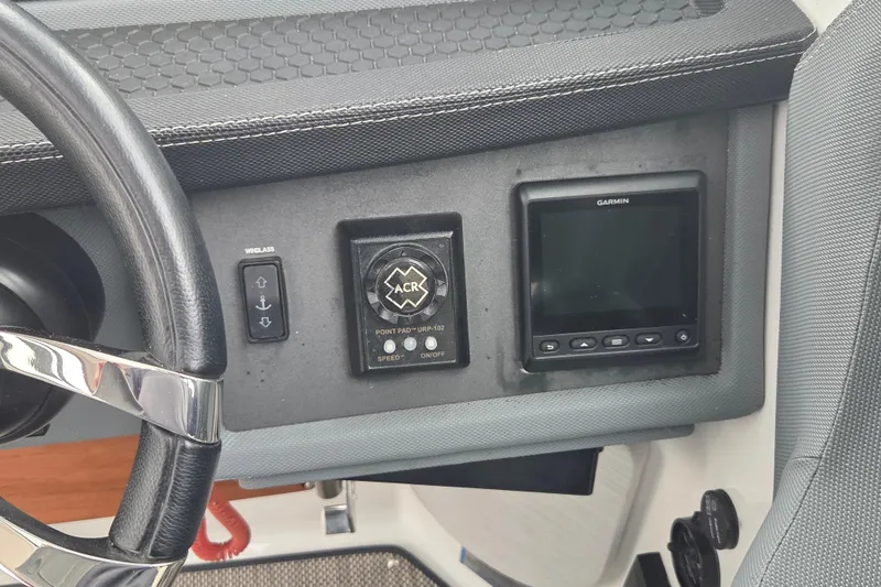 Slide: The Image of Control panel of a 2017 Cobalt A40 Coupe featuring Garmin display and steering wheel. - 9