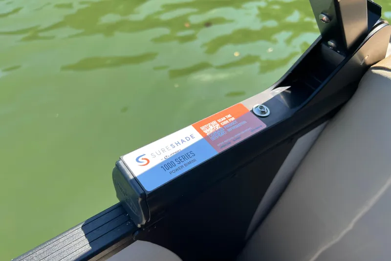 Slide: The Image of SureShade 1000 Series power bimini on 2026 Manitou 23 Aurora LE RF boat. - 12