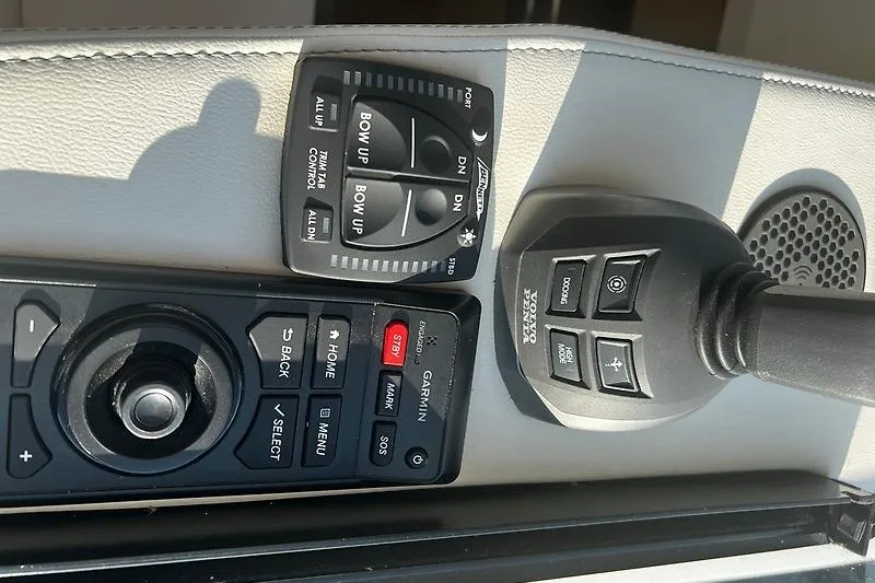 Slide: The Image of Control panel of 2024 Regal 38 Grande Coupe with joystick and navigation buttons. - 19