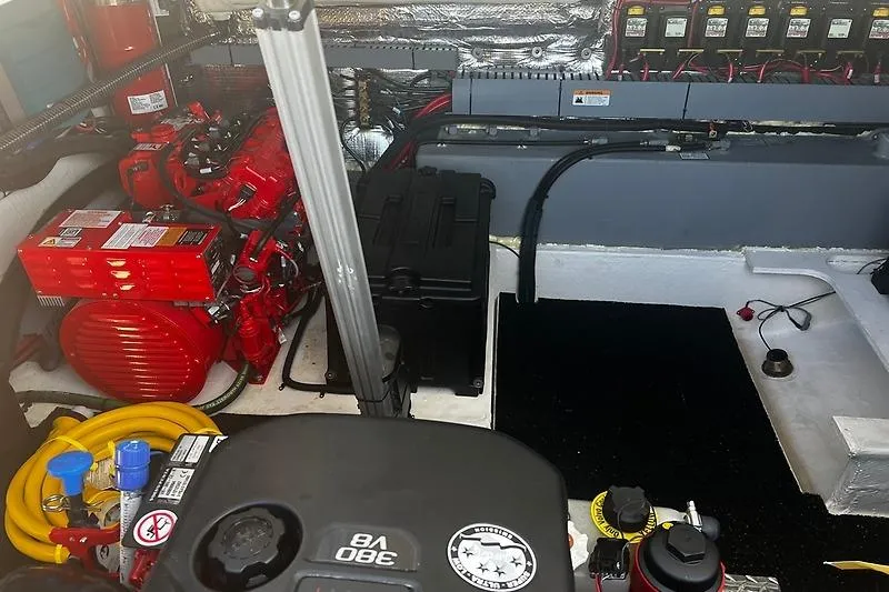Slide: The Image of Engine room of 2024 Regal 38 Grande Coupe with visible components and wiring. - 34