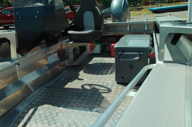 Slide: The Image of Interior of 2026 Stabicraft 1450 Frontier boat with seating and storage. - 11