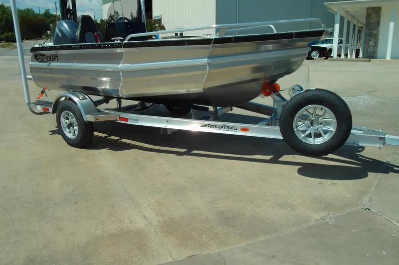 Slide: The Image of 2026 Stabicraft 1450 Frontier boat on trailer, parked outdoors. - 3