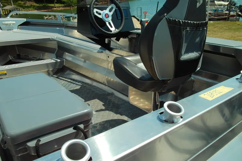 Slide: The Image of 2026 Stabicraft 1450 Frontier boat interior with steering wheel and seating. - 6