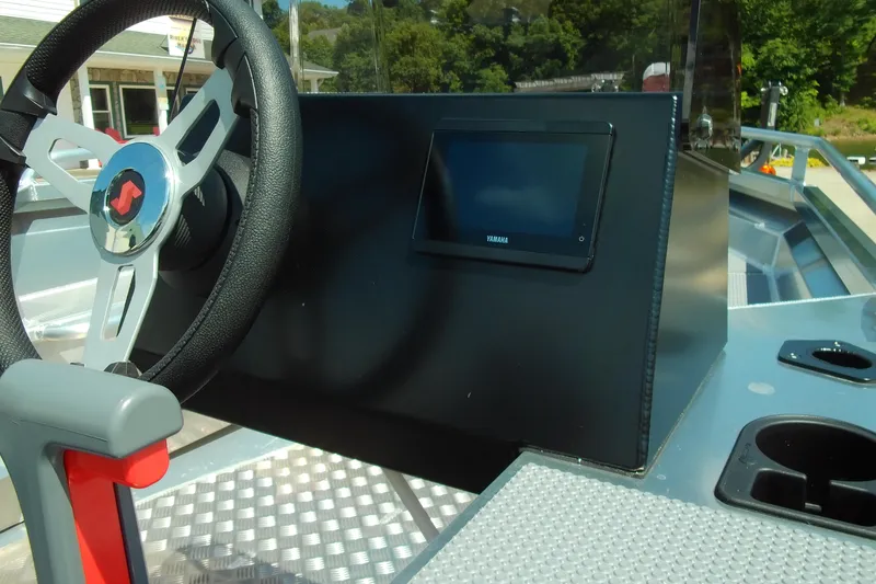Slide: The Image of 2026 Stabicraft 1450 Frontier boat dashboard with steering wheel and Yamaha display. - 7