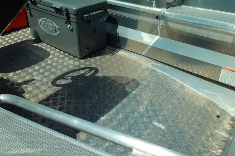 Slide: The Image of 2026 Stabicraft 1450 Frontier interior with textured flooring and storage box. - 9