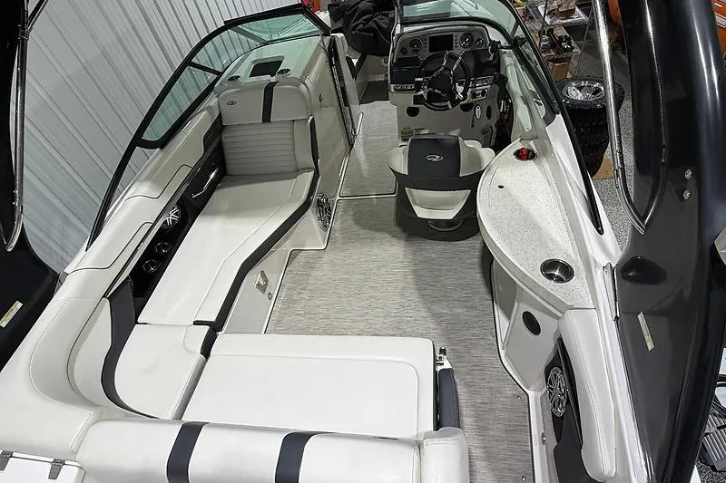 Slide: The Image of Interior of a 2016 Regal 24 FasDeck RX boat with sleek seating and modern dashboard. - 10