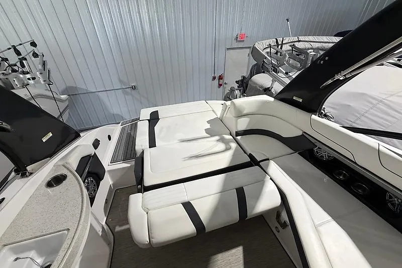 Slide: The Image of 2016 Regal 24 FasDeck RX boat interior with white seating and modern design. - 15