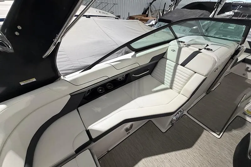 Slide: The Image of 2016 Regal 24 FasDeck RX boat interior with sleek white seating and modern design. - 17