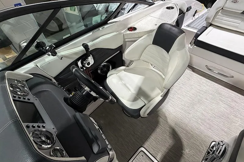 Slide: The Image of Interior view of 2016 Regal 24 FasDeck RX boat cockpit with steering wheel and seating. - 18