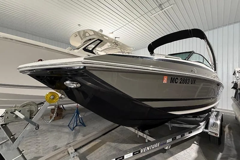 Slide: The Image of 2016 Regal 24 FasDeck RX boat on trailer in indoor storage facility. - 2
