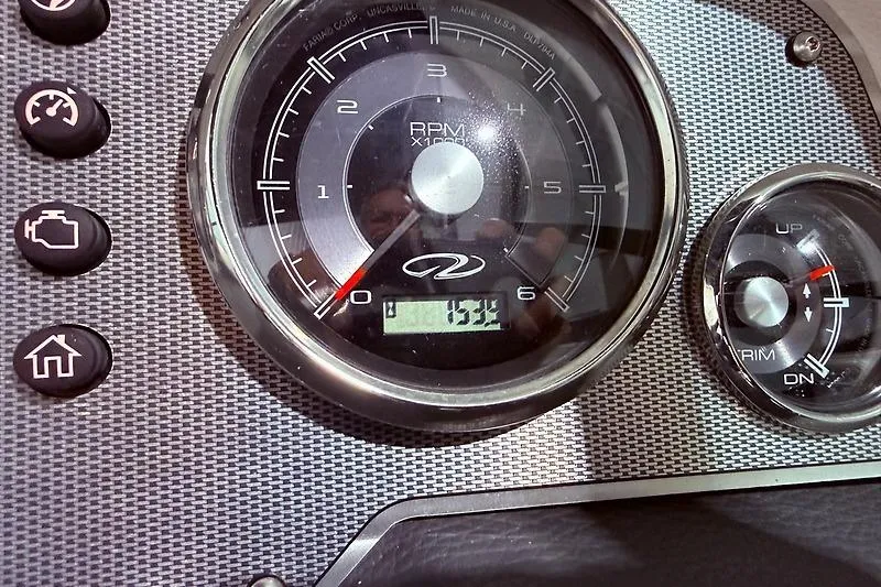 Slide: The Image of Dashboard of a 2016 Regal 24 FasDeck RX boat showing RPM gauge and controls. - 22