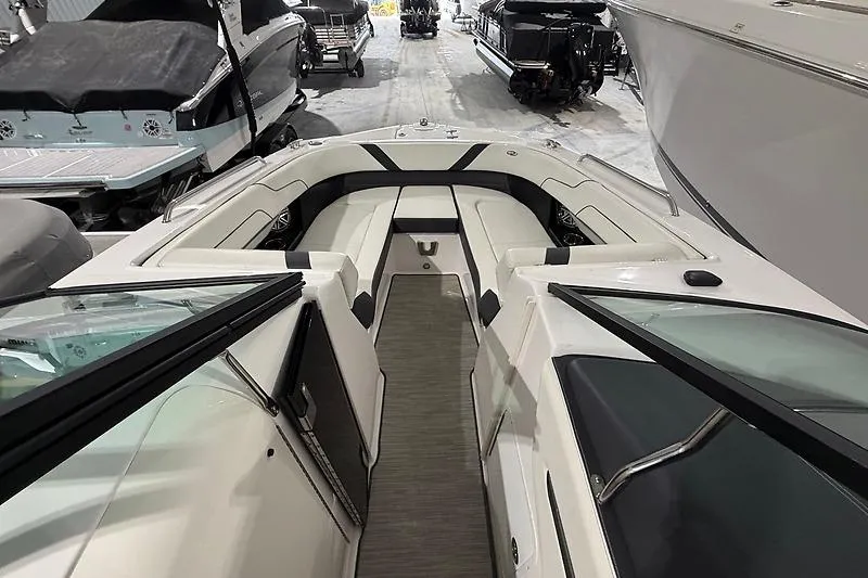Slide: The Image of 2016 Regal 24 FasDeck RX boat interior with sleek seating and modern design. - 24