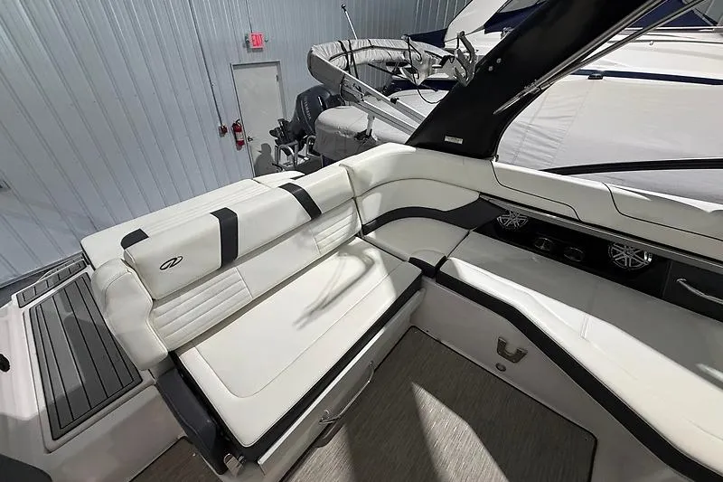 Slide: The Image of 2016 Regal 24 FasDeck RX boat interior with white seating and modern design. - 26