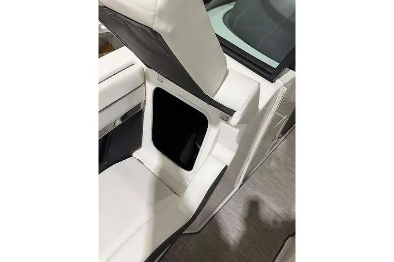 Slide: The Image of 2016 Regal 24 FasDeck RX boat seat with open storage compartment. - 27