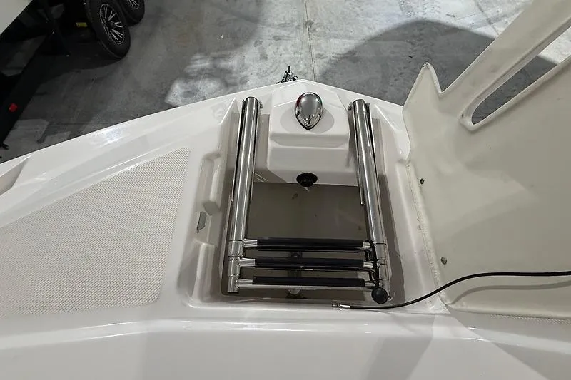 Slide: The Image of 2016 Regal 24 FasDeck RX boat ladder and anchor compartment. - 28