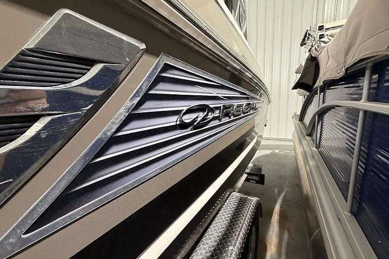 Slide: The Image of 2016 Regal 24 FasDeck RX boat in storage, close-up of side detailing. - 3