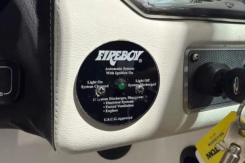 Slide: The Image of Fireboy automatic system panel on 2016 Regal 24 FasDeck RX boat dashboard. - 32
