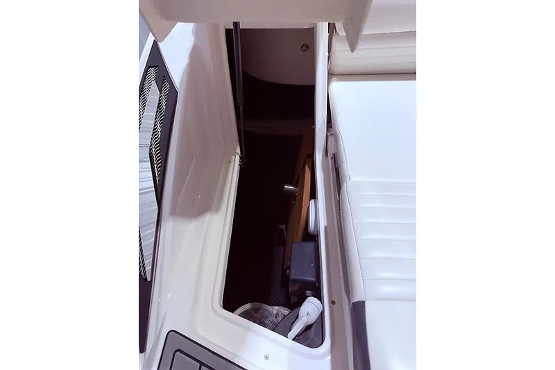 Slide: The Image of Storage compartment in 2016 Regal 24 FasDeck RX boat interior. - 33