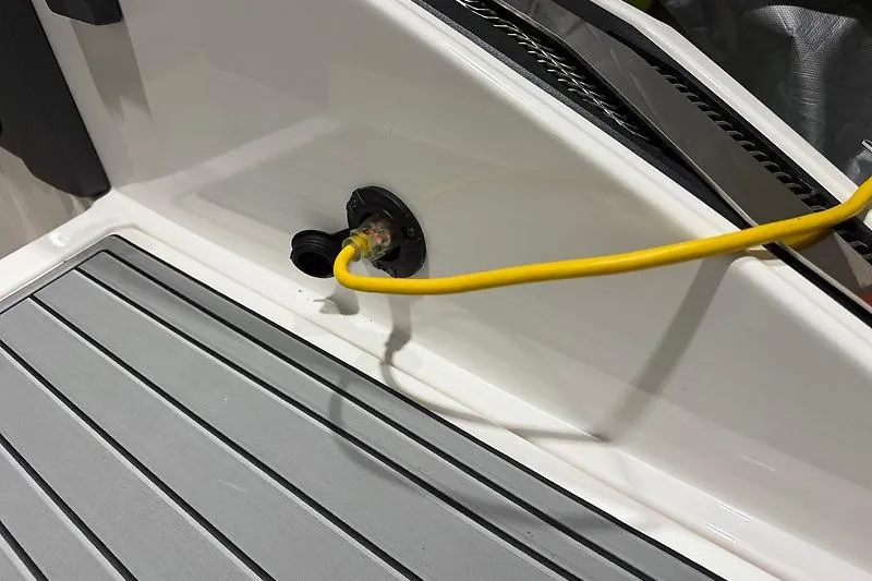 Slide: The Image of Yellow power cable connected to a 2016 Regal 24 FasDeck RX boat deck. - 37