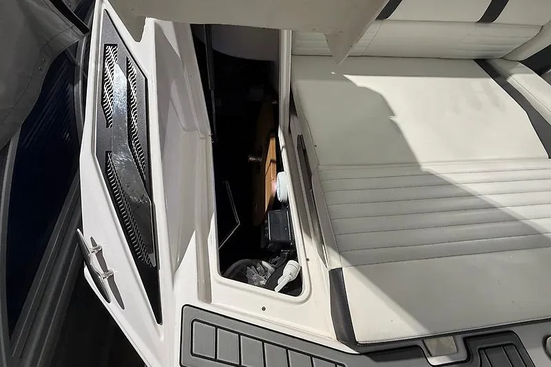 Slide: The Image of 2016 Regal 24 FasDeck RX boat interior storage compartment with white seating. - 38