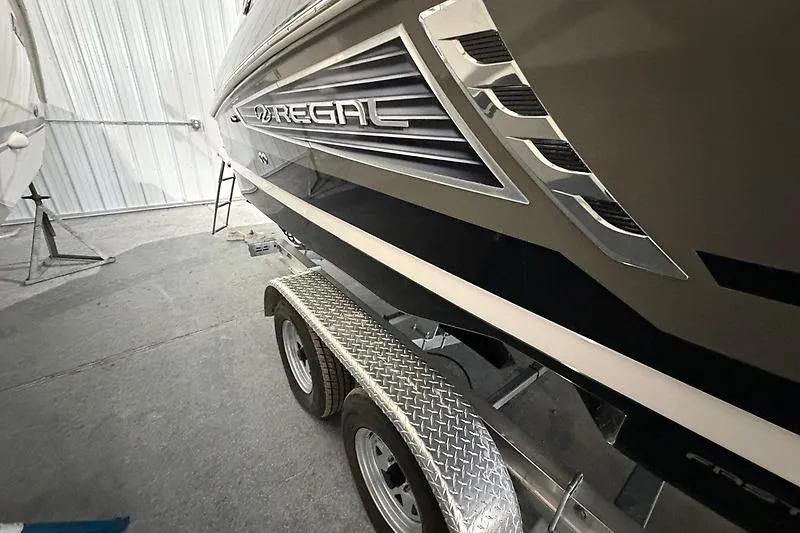 Slide: The Image of 2016 Regal 24 FasDeck RX boat on trailer in storage facility. - 4