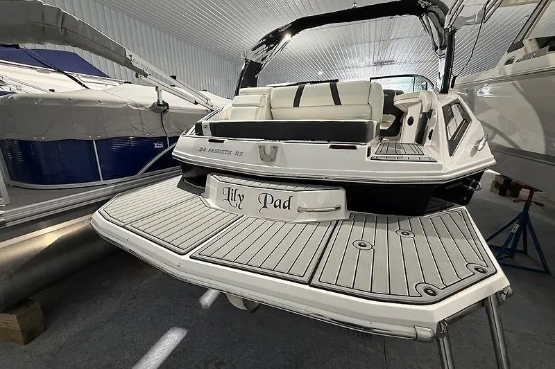 Slide: The Image of 2016 Regal 24 FasDeck RX boat with "Lily Pad" name, docked indoors. - 6