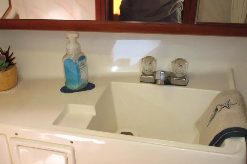 Slide: The Image of Bathroom sink area in 1989 Bayliner 3288 Motoryacht with soap and towel. - 11
