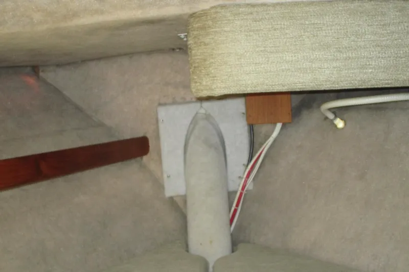 Slide: The Image of Interior view of a 1989 Bayliner 3288 Motoryacht showing wiring and structural components. - 14