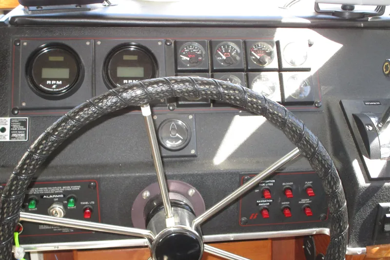 Slide: The Image of Dashboard of a 1989 Bayliner 3288 Motoryacht with steering wheel and gauges. - 5