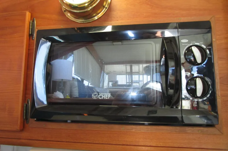 Slide: The Image of Microwave oven inside 1989 Bayliner 3288 Motoryacht, mounted on wooden cabinetry. - 8