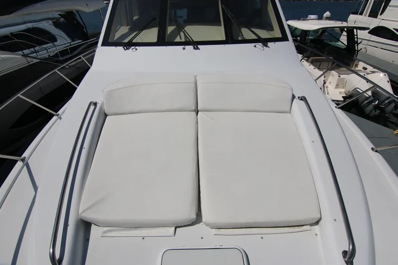Slide: The Image of 2002 Hatteras 63 Raised Pilothouse Motor Yacht with sunpad on deck. - 12