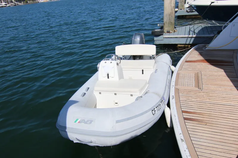 Slide: The Image of Inflatable dinghy docked beside a 2002 Hatteras 63 Raised Pilothouse Motor Yacht. - 13