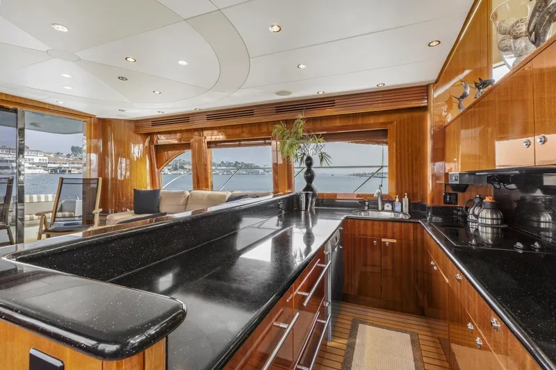 Slide: The Image of Luxurious kitchen interior of 2002 Hatteras 63 Raised Pilothouse Motor Yacht with waterfront view. - 17