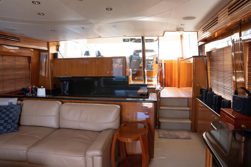 Slide: The Image of Luxurious interior of 2002 Hatteras 63 Raised Pilothouse Motor Yacht with leather seating and wood finishes. - 20