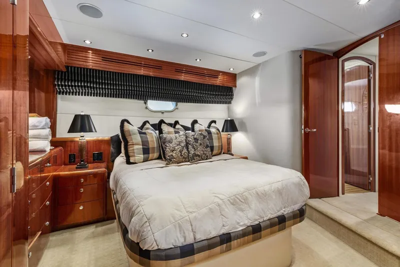 Slide: The Image of Luxurious bedroom in 2002 Hatteras 63 Raised Pilothouse Motor Yacht with elegant wood finishes. - 24