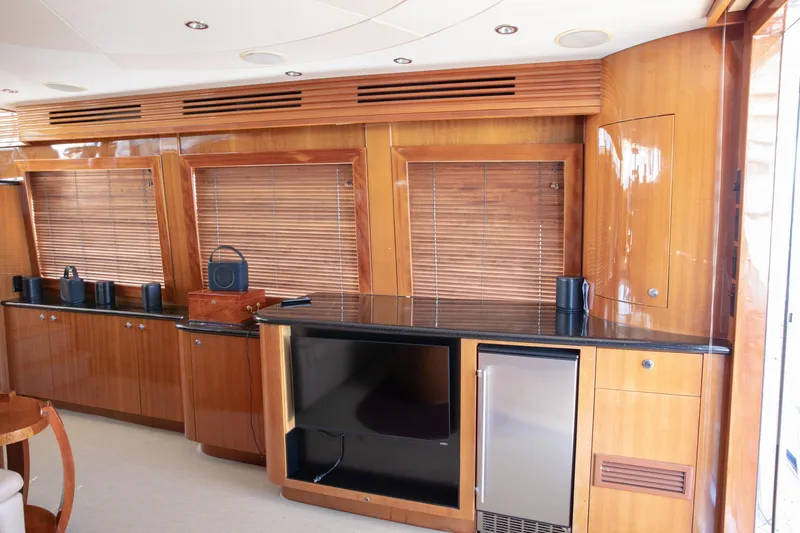 Slide: The Image of Luxurious interior of 2002 Hatteras 63 Raised Pilothouse Motor Yacht with wooden cabinetry. - 25